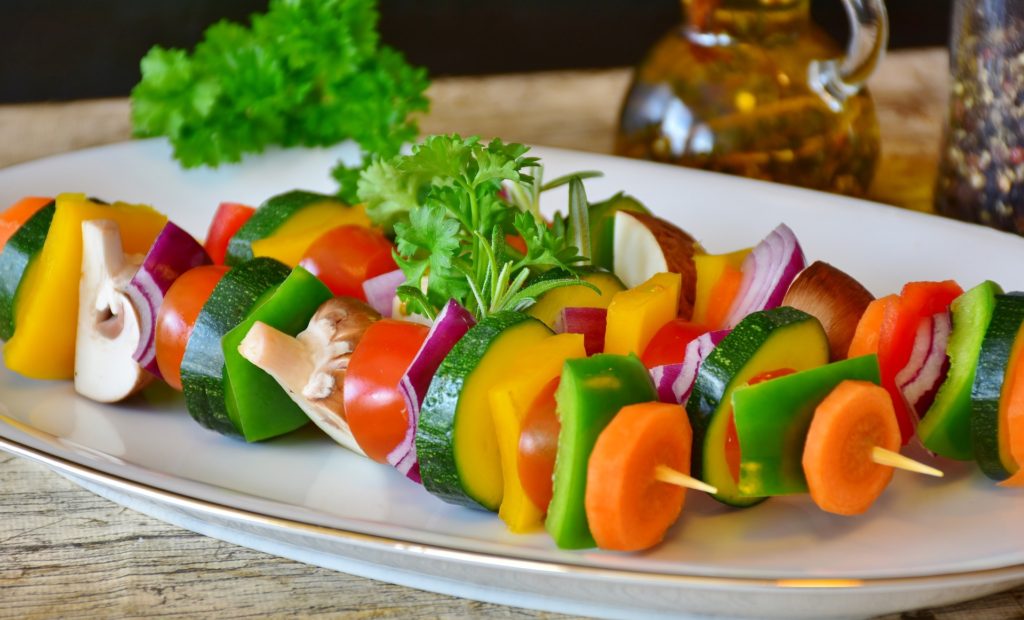 Forks Over Knives Review a lot of different pieces of vegetables on 2 sticks on plate