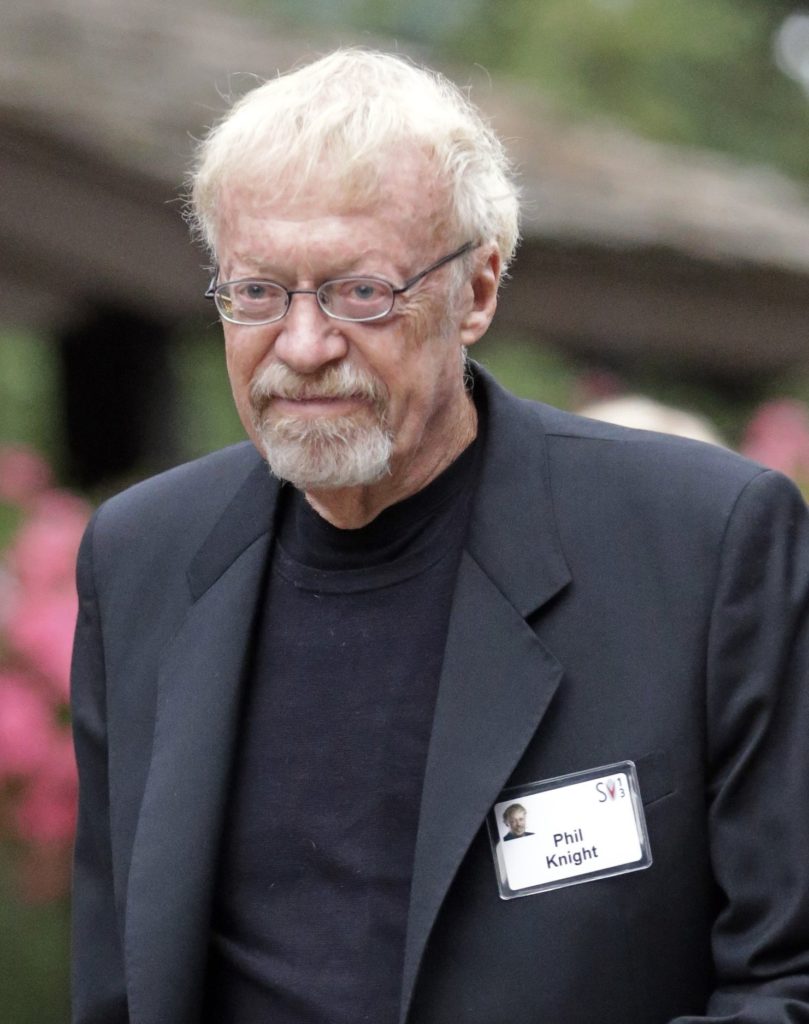 Shoe Dog Book Review Mr Phil Knight in a suit, glasses and a name badge