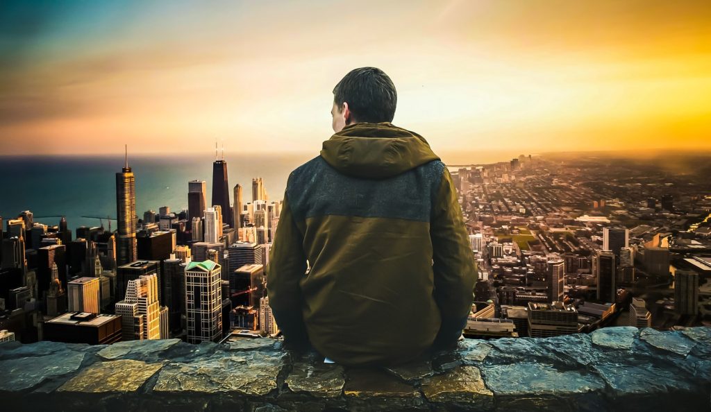 A guy looking at the city scenery